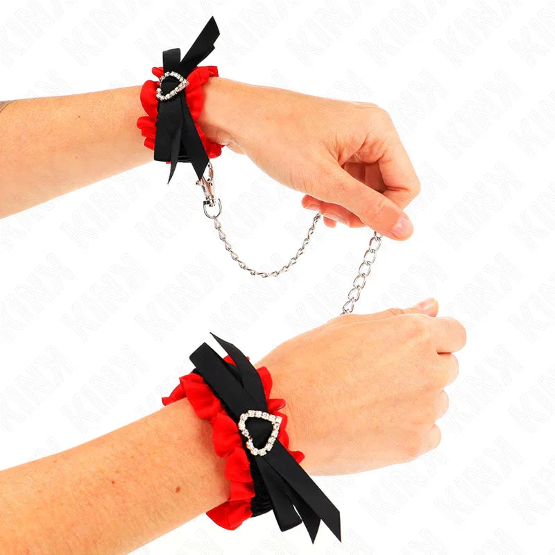 KINK - MUÑEQUERAS ELÁSTICAS DE ENCAJE CON DETALLE CORAZÓN ROJO AJUSTABLE 22-35 CM - Nuvica
