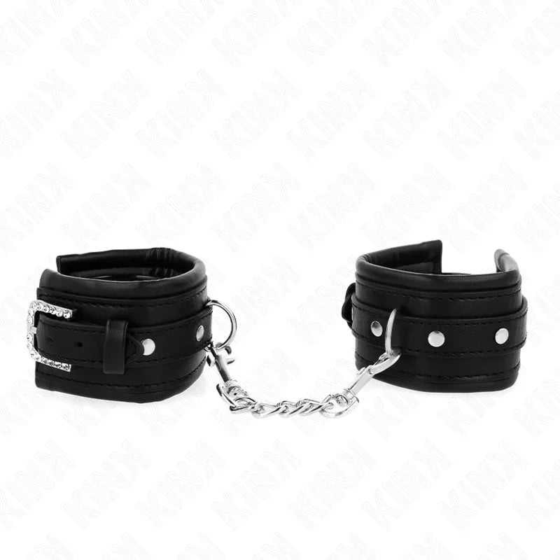 KINK - MUÑEQUERAS NEGRO CON HEBILLA DE DIAMANTES DE IMITACIÓN AJUSTABLE 25-32 CM X 5.5 CM - Nuvica