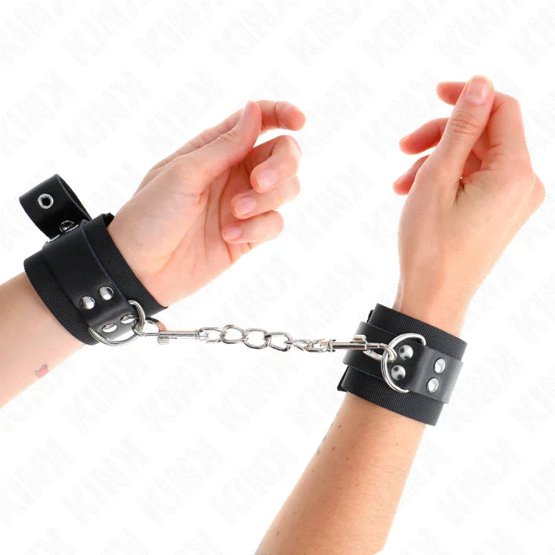 KINK - MUÑEQUERAS DE NYLON NEGRO CON CORREA CUERO NEGRO AJUSTABLE 19-29 CM X 5.1 CM - Nuvica