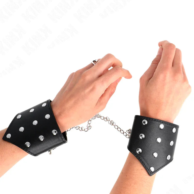 KINK - MUÑEQUERAS ESTILO PUNTIAGUDO NEGRO CON CADENA AJUSTABLE 17-23 CM X 8.5 CM - Nuvica