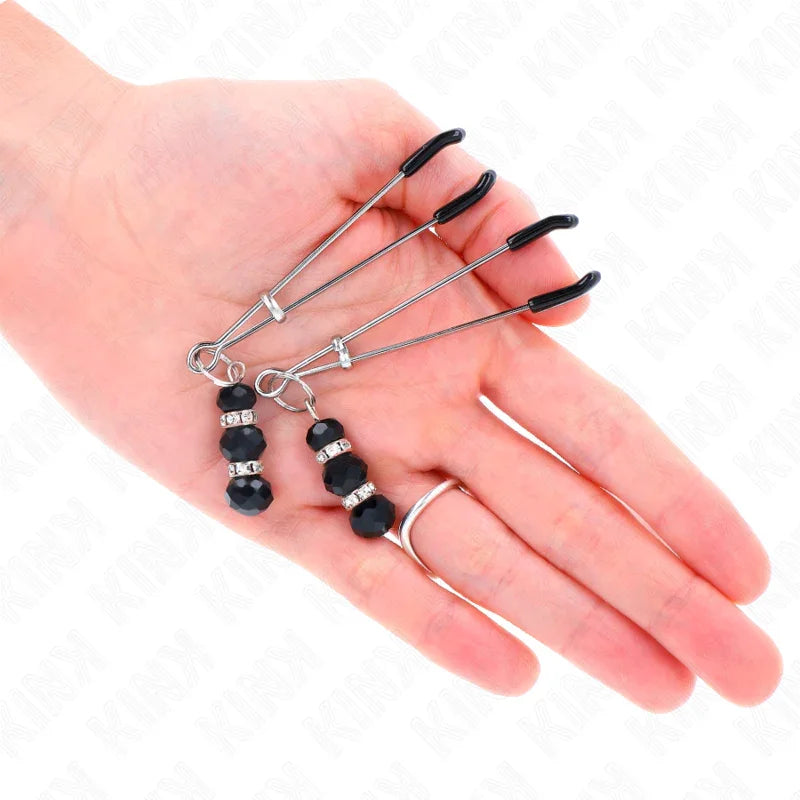 KINK - PINZAS PARA PEZONES PLATEADA FINA CON TRIPLE BOLA DE VIDRIO NEGRO 7 CM - Nuvica