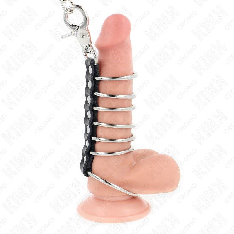 KINK - 7 ANILLOS PENE METAL 3.8 CM A 5 CM CONECTADOS CON POLIPIEL Y CADENA METAL 100 CM - Nuvica