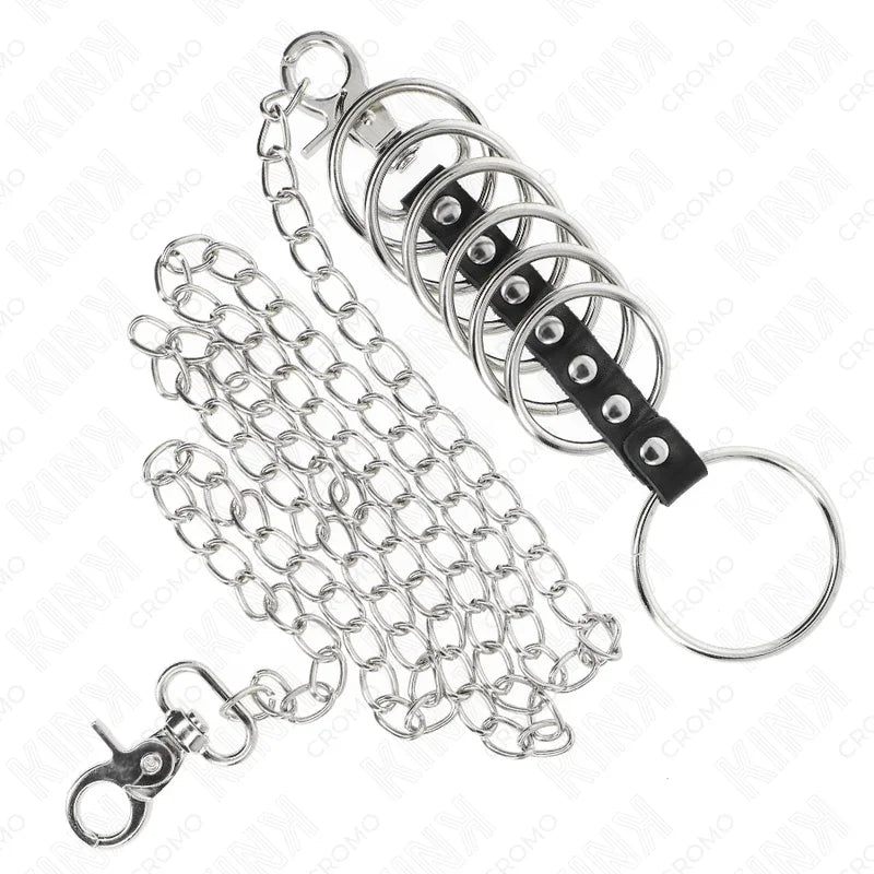 KINK - 7 ANILLOS PENE METAL 3.8 CM A 5 CM CONECTADOS CON POLIPIEL Y CADENA METAL 100 CM - Nuvica