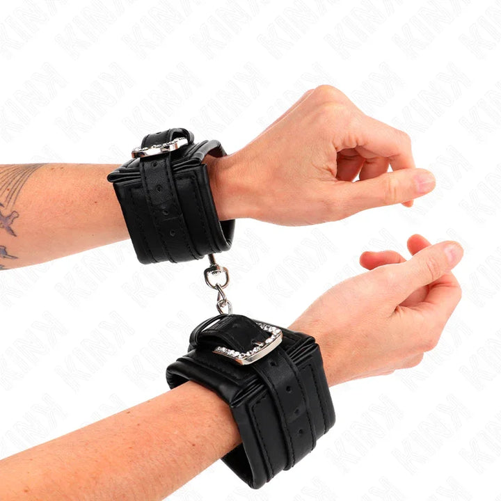 KINK - MUÑEQUERAS NEGRO CON HEBILLA DE DIAMANTES DE IMITACIÓN AJUSTABLE 25-32 CM X 5.5 CM - Nuvica