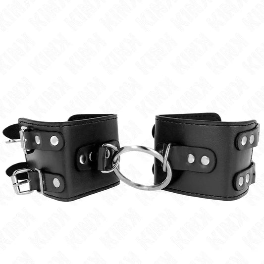 KINK - MUÑEQUERAS FIJAS CON ANILLA Y TACHUELAS NEGRO AJUSTABLE 17-22 CM X 6.5 CM - Nuvica
